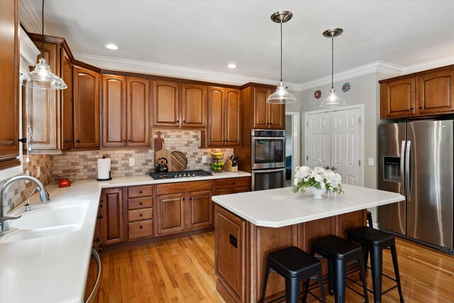 71438 Forest Eagle Ln, Niles, MI 49120 - kitchen with stainless steel appliances, a kitchen bar, light wood-style floors, tasteful backsplash, and a center island