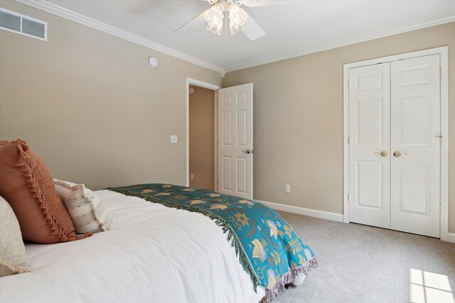 71438 Forest Eagle Ln, Niles, MI 49120 - bedroom with ornamental molding, carpet, ceiling fan, baseboards, and a closet