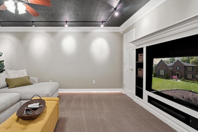 71438 Forest Eagle Ln, Niles, MI 49120 - carpeted living area featuring track lighting, crown molding, ceiling fan, built in shelves, and baseboards