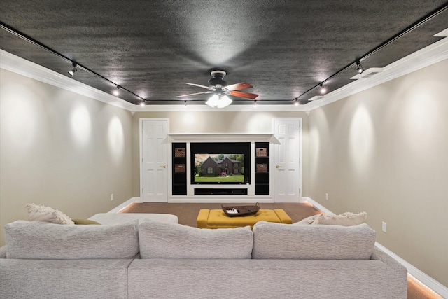 71438 Forest Eagle Ln, Niles, MI 49120 - carpeted home theater featuring rail lighting, ceiling fan, ornamental molding, and baseboards