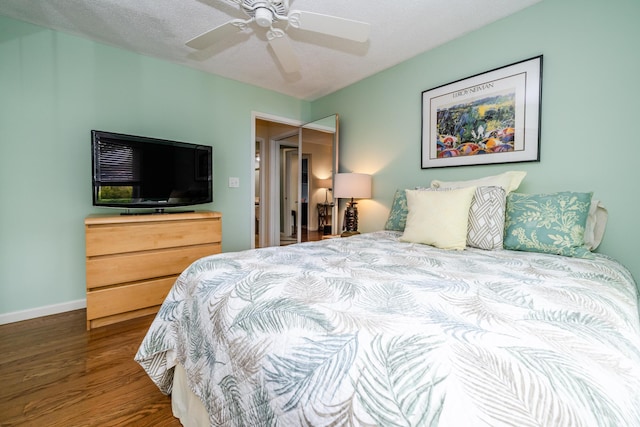 193 Wayne St, Saint Joseph, MI 49085 - bedroom with wood finished floors, ceiling fan, and baseboards