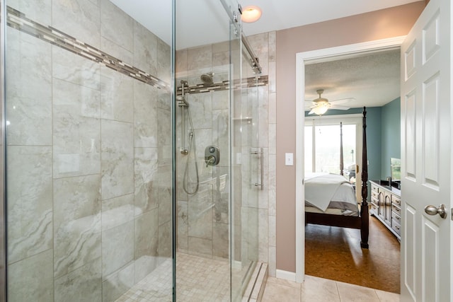193 Wayne St, Saint Joseph, MI 49085 - bathroom featuring ensuite bath, a shower stall, tile patterned floors, a ceiling fan, and baseboards