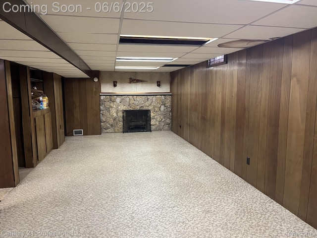3028 Earl Dr, Warren, MI 48092 - finished below grade area featuring a paneled ceiling, wood walls, and a stone fireplace