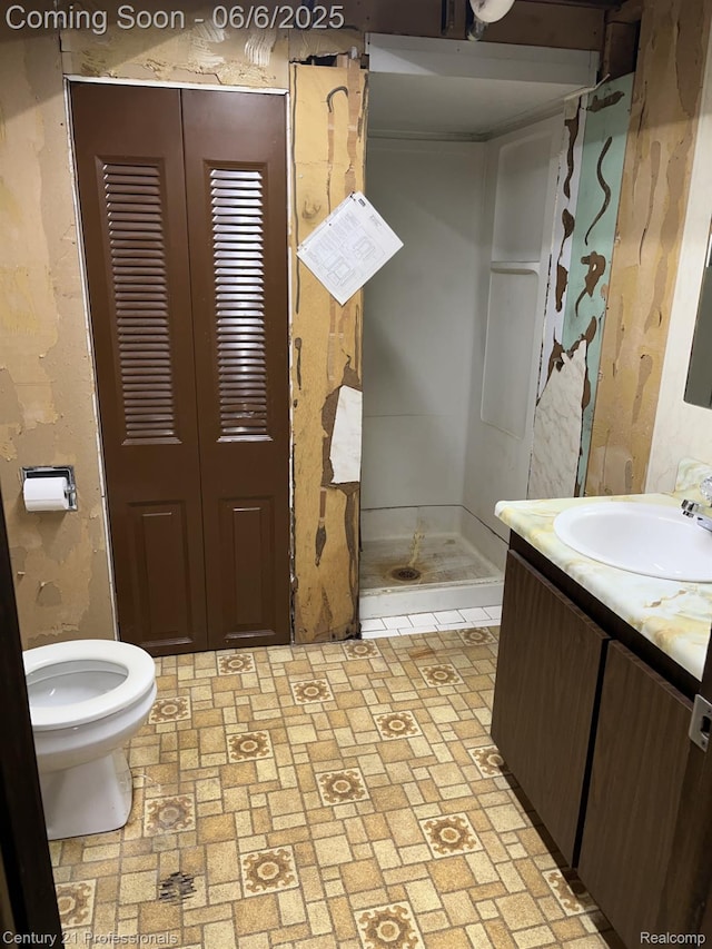 3028 Earl Dr, Warren, MI 48092 - bathroom featuring a stall shower, vanity, toilet, and brick patterned floors