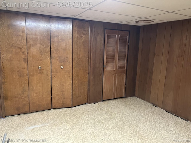 3028 Earl Dr, Warren, MI 48092 - unfurnished bedroom featuring a paneled ceiling and wood walls