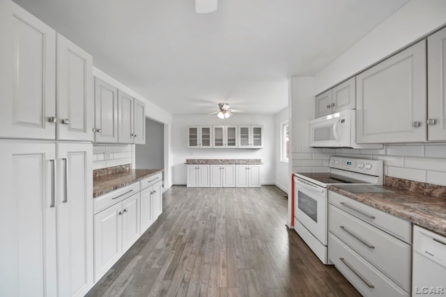 5662 Caren Dr, Ypsilanti, MI 48197 - kitchen with white appliances, backsplash, a ceiling fan, dark wood-type flooring, and baseboards