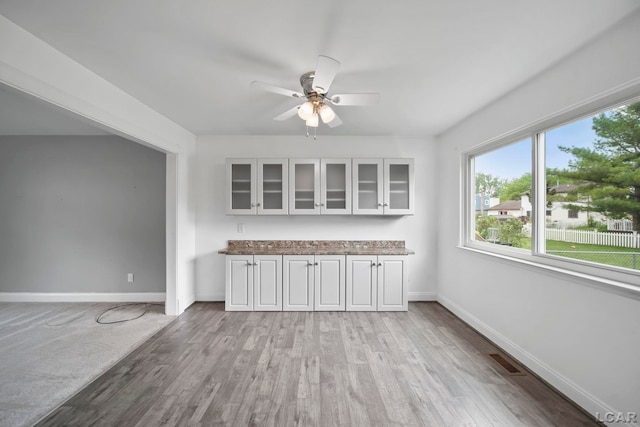 5662 Caren Dr, Ypsilanti, MI 48197 - interior space with a ceiling fan, baseboards, and light wood-style floors