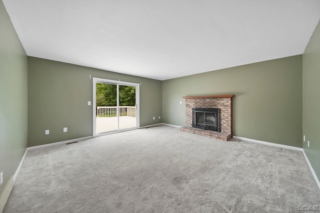 5662 Caren Dr, Ypsilanti, MI 48197 - unfurnished living room featuring carpet, baseboards, and a fireplace