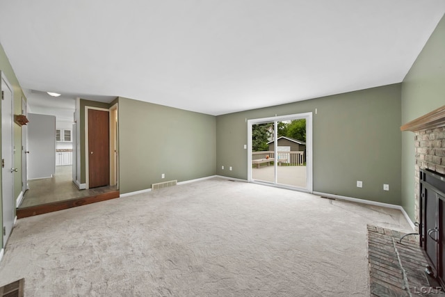 5662 Caren Dr, Ypsilanti, MI 48197 - unfurnished living room with a fireplace, carpet, and baseboards