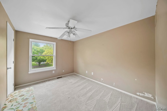 5662 Caren Dr, Ypsilanti, MI 48197 - empty room with baseboards, carpet floors, and a ceiling fan