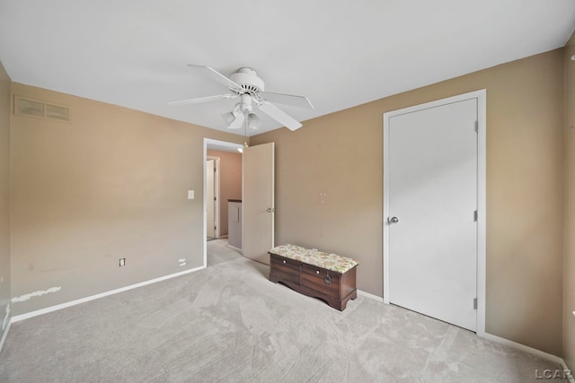 5662 Caren Dr, Ypsilanti, MI 48197 - unfurnished bedroom with carpet floors, baseboards, and ceiling fan