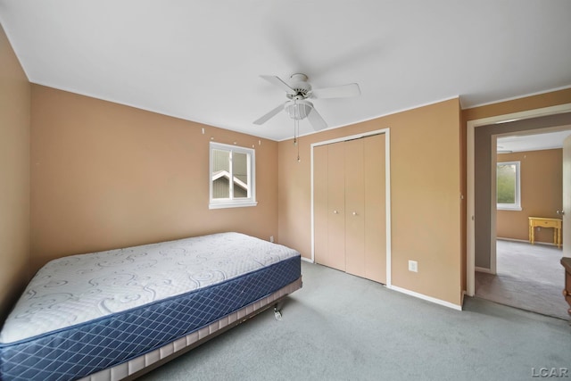 5662 Caren Dr, Ypsilanti, MI 48197 - bedroom with a closet, carpet, baseboards, and a ceiling fan
