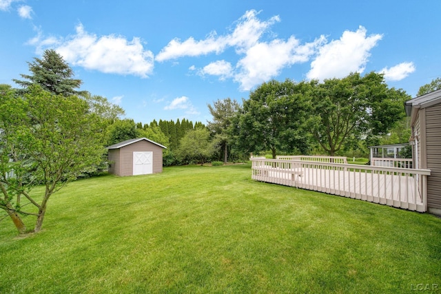 5662 Caren Dr, Ypsilanti, MI 48197 - view of green lawn with a deck