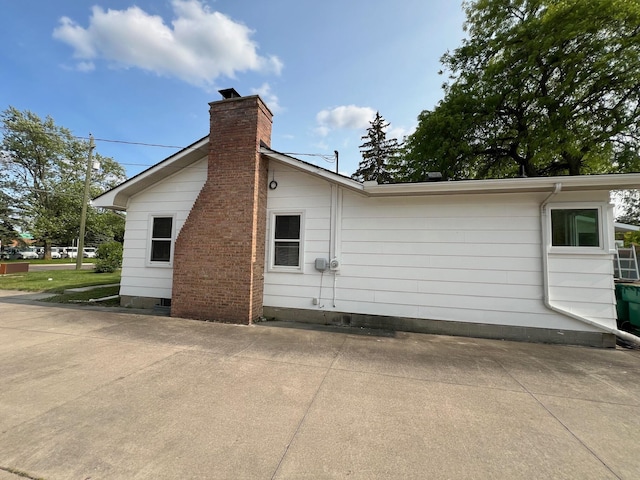 111 N Maple Rd, Saline, MI 48176 - view of property exterior with a chimney