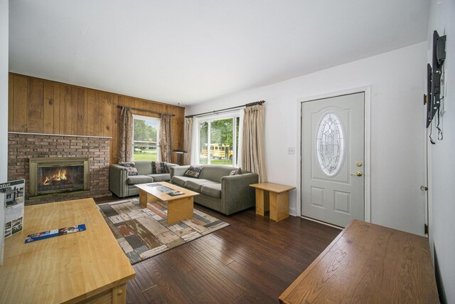 111 N Maple Rd, Saline, MI 48176 - living room with dark wood finished floors and a brick fireplace
