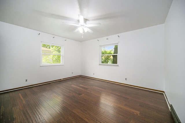 111 N Maple Rd, Saline, MI 48176 - spare room featuring healthy amount of natural light, a ceiling fan, hardwood / wood-style floors, and baseboards