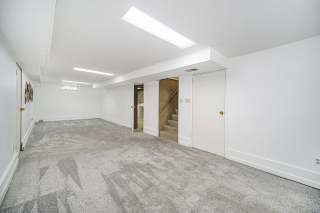 111 N Maple Rd, Saline, MI 48176 - below grade area featuring stairway, carpet flooring, and baseboards
