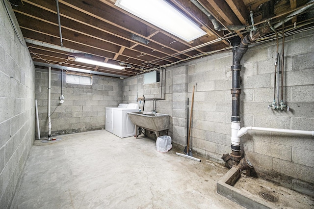 111 N Maple Rd, Saline, MI 48176 - unfinished below grade area with washer and dryer and a sink
