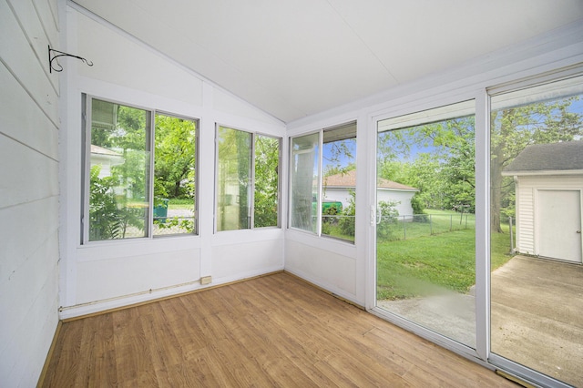 111 N Maple Rd, Saline, MI 48176 - unfurnished sunroom with wood finished floors and lofted ceiling