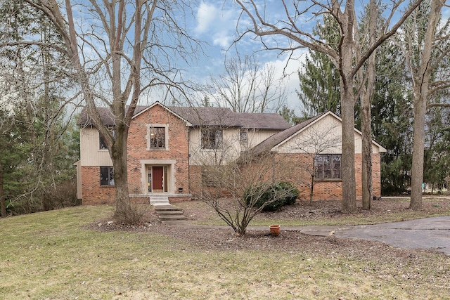 3329 Craig Rd, Ann Arbor, MI 48103 - traditional-style home featuring brick siding and a front lawn