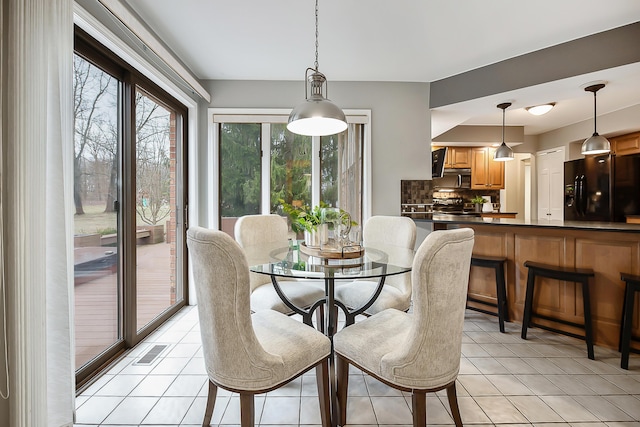3329 Craig Rd, Ann Arbor, MI 48103 - dining area with light tile patterned floors