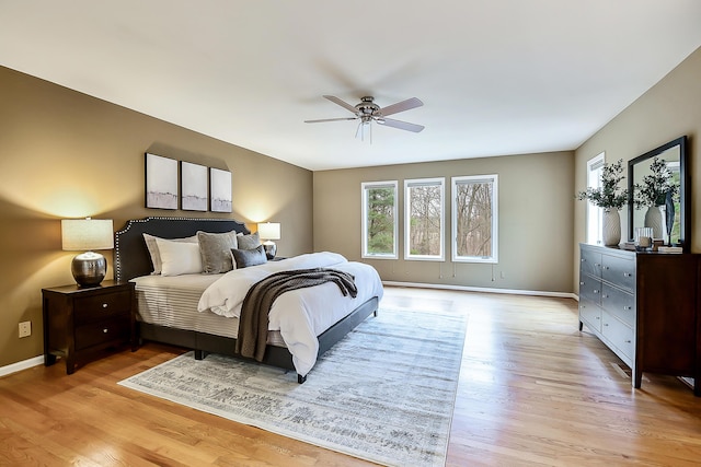 3329 Craig Rd, Ann Arbor, MI 48103 - bedroom with light wood-style flooring, baseboards, and a ceiling fan
