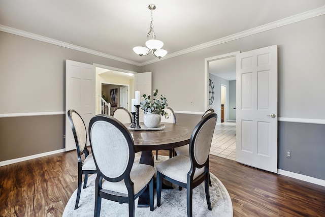 3329 Craig Rd, Ann Arbor, MI 48103 - dining room with baseboards, ornamental molding, dark wood finished floors, and a chandelier