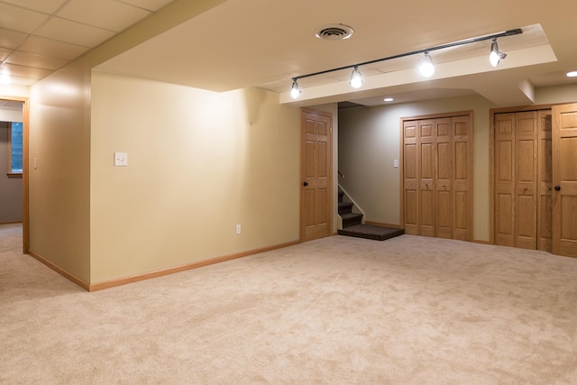 3329 Craig Rd, Ann Arbor, MI 48103 - finished below grade area featuring track lighting, carpet floors, stairway, and baseboards