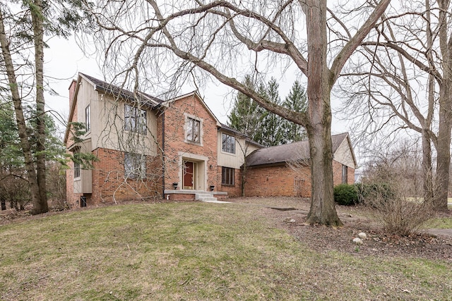 3329 Craig Rd, Ann Arbor, MI 48103 - view of front facade featuring brick siding and a front yard