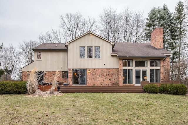 3329 Craig Rd, Ann Arbor, MI 48103 - back of house featuring brick siding, a chimney, and a lawn