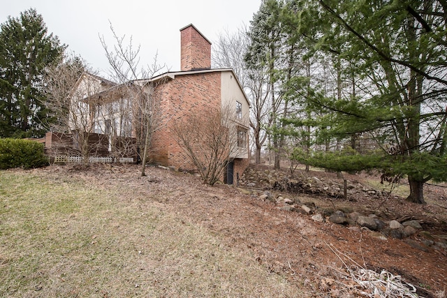 3329 Craig Rd, Ann Arbor, MI 48103 - view of property exterior featuring a chimney and brick siding