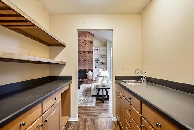 3329 Craig Rd, Ann Arbor, MI 48103 - bar area featuring a sink, dark wood finished floors, and baseboards