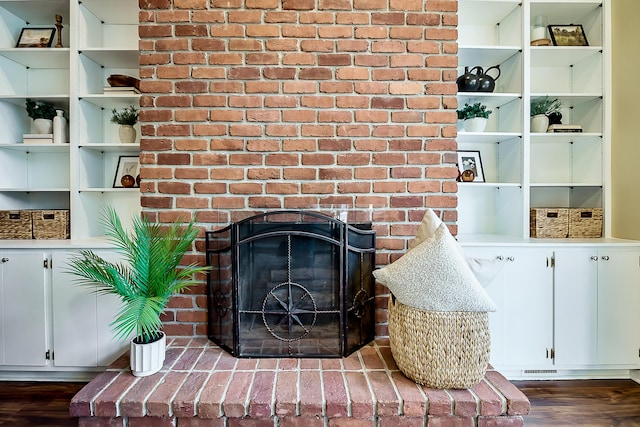3329 Craig Rd, Ann Arbor, MI 48103 - detailed view of wood finished floors and a brick fireplace