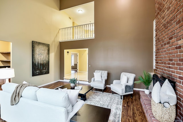 3329 Craig Rd, Ann Arbor, MI 48103 - living area featuring wood finished floors, baseboards, and a high ceiling