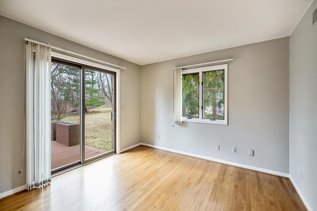 3329 Craig Rd, Ann Arbor, MI 48103 - empty room featuring wood-type flooring and baseboards