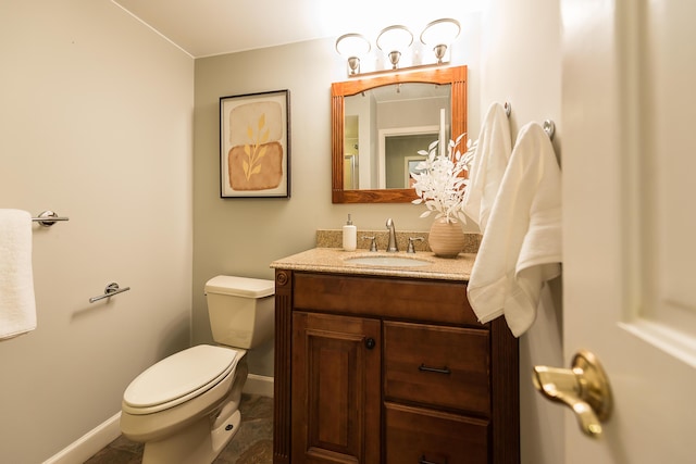 3329 Craig Rd, Ann Arbor, MI 48103 - bathroom with vanity, toilet, and baseboards