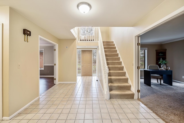 3329 Craig Rd, Ann Arbor, MI 48103 - foyer entrance featuring stairs, light tile patterned floors, and baseboards