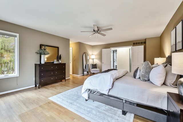 3329 Craig Rd, Ann Arbor, MI 48103 - bedroom featuring light wood-style flooring, baseboards, and a ceiling fan