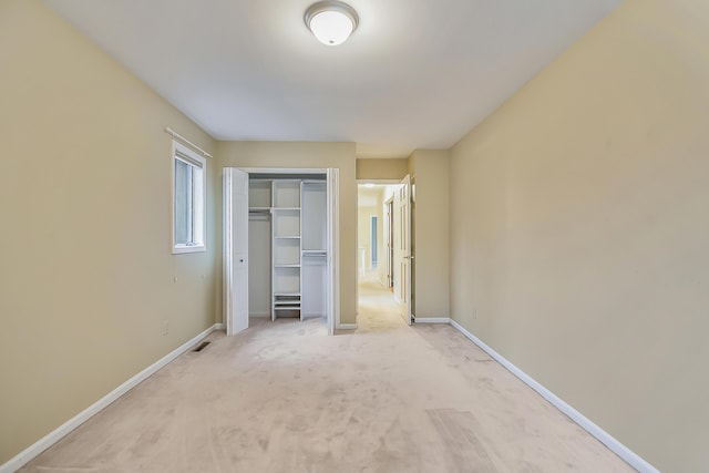 3329 Craig Rd, Ann Arbor, MI 48103 - unfurnished bedroom with light carpet, a closet, and baseboards