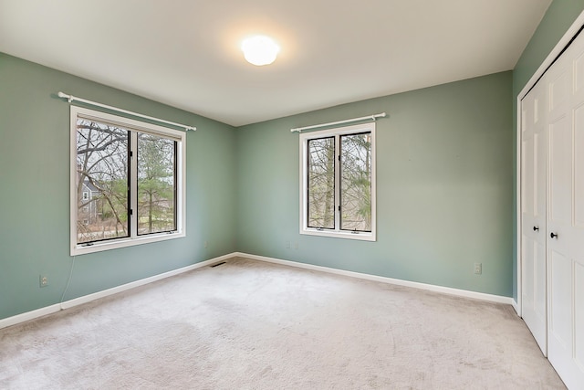 3329 Craig Rd, Ann Arbor, MI 48103 - unfurnished bedroom with a closet, carpet floors, and baseboards