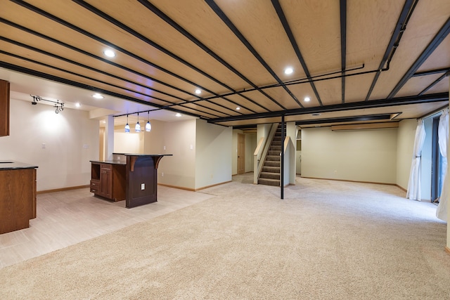 3329 Craig Rd, Ann Arbor, MI 48103 - finished below grade area featuring recessed lighting, bar area, baseboards, stairs, and light colored carpet