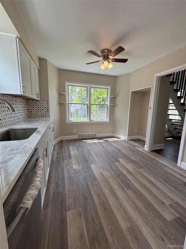 1139 S 7th St, Ann Arbor, MI 48103 - unfurnished living room with a sink, stairway, a ceiling fan, dark wood-type flooring, and baseboards