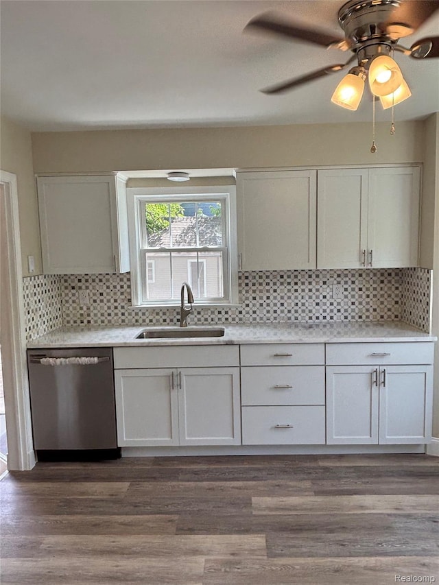 1139 S 7th St, Ann Arbor, MI 48103 - kitchen with stainless steel dishwasher, a sink, backsplash, and light countertops