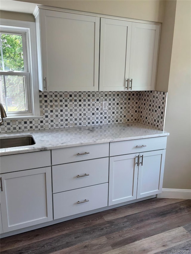 1139 S 7th St, Ann Arbor, MI 48103 - kitchen featuring a sink, tasteful backsplash, dark wood finished floors, and white cabinets