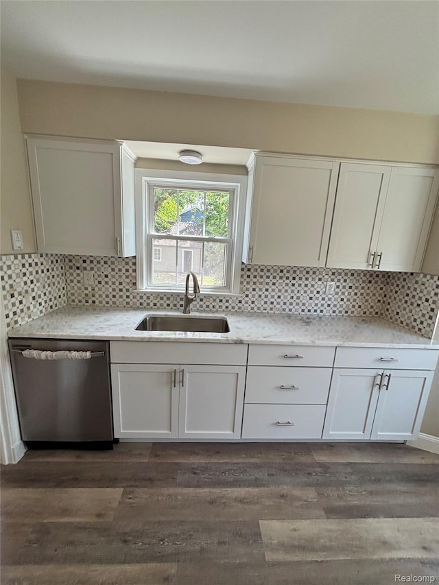 1139 S 7th St, Ann Arbor, MI 48103 - kitchen with dishwasher, a sink, and white cabinetry