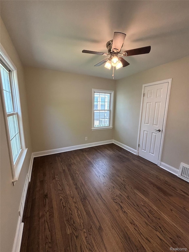 1139 S 7th St, Ann Arbor, MI 48103 - unfurnished room with dark wood-style floors, a ceiling fan, and baseboards