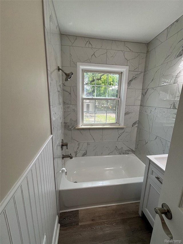 1139 S 7th St, Ann Arbor, MI 48103 - bathroom with vanity, wood finished floors, and tub / shower combination
