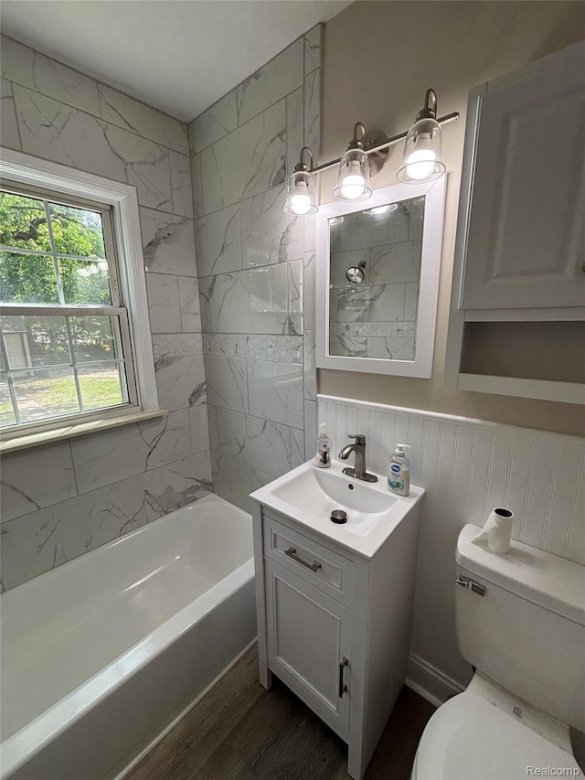 1139 S 7th St, Ann Arbor, MI 48103 - full bath with vanity, toilet, shower / bathtub combination, and wood finished floors