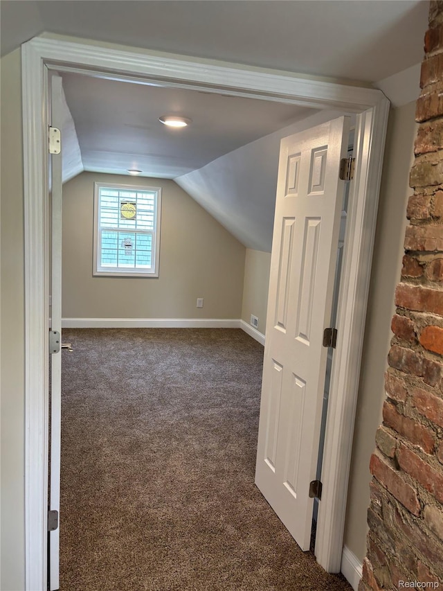 1139 S 7th St, Ann Arbor, MI 48103 - bonus room with dark carpet, lofted ceiling, and baseboards