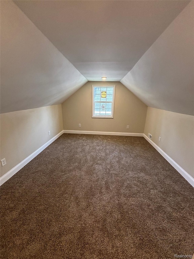 1139 S 7th St, Ann Arbor, MI 48103 - bonus room featuring lofted ceiling, dark carpet, and baseboards